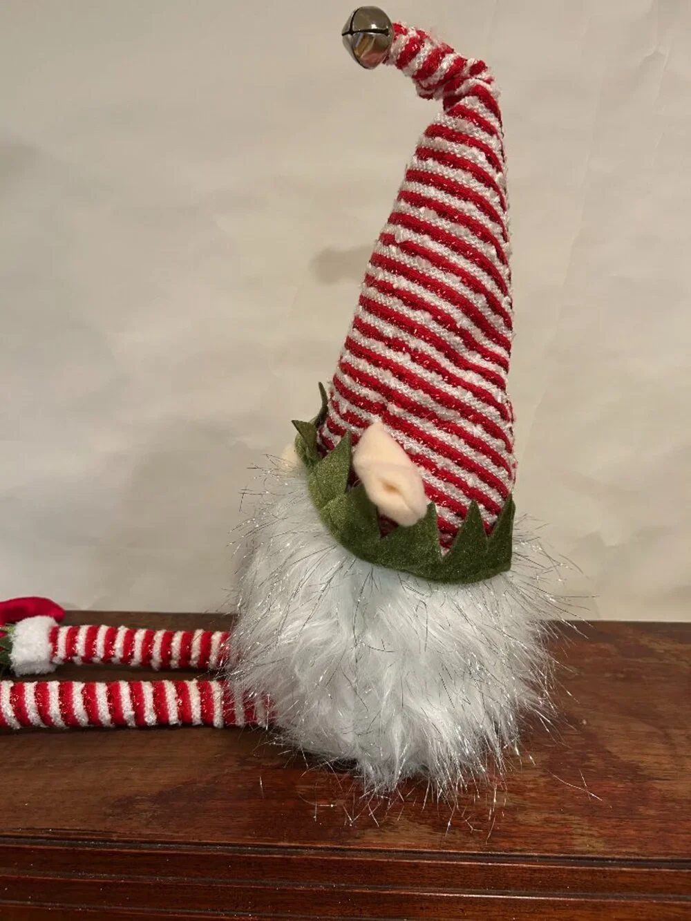 Christmas Holiday Gnome with red and white striped cap and wispy, sparkly white